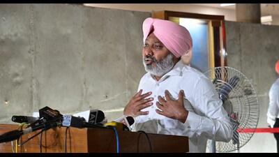 Punjab finance minister interacting with the media after the adjournment of the first sitting of the two-day special session of the Punjab assembly in Chandigarh on Thursday. (Ravi Kumar/HT) Punjab finance minister interacting with the media after the adjournment of the first sitting of the two-day special session of the Punjab assembly in Chandigarh on Thursday. (Ravi Kumar/HT)