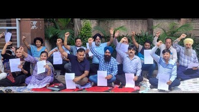 Residents of HM Colony, Punjab Housing Board, Urban Estate, staging a protest at the GLADA office over “illegal” construction in Jamalpur on Thursday. (HT Photo)