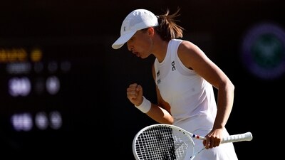 Poland's Iga Swiatek reacts during her semi final match against Switzerland's Belinda Bencic (REUTERS)