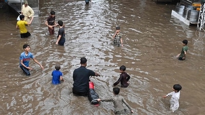 Children play in flooded water after heavy monsoon rains. Doctor recommends 6 ways parents can keep kids safe from deadly infections this rainy season. (AFP Photo by Arif ALI) Children play in flooded water after heavy monsoon rains. Doctor recommends 6 ways parents can keep kids safe from deadly infections this rainy season. (AFP Photo by Arif ALI)