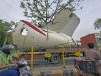 A truck carrying wreckage of the Air India plane that recently crashed into a medical hostel and its canteen complex passes by, in Ahmedabad, on Sunday. A truck carrying wreckage of the Air India plane that recently crashed into a medical hostel and its canteen complex passes by, in Ahmedabad, on Sunday.