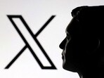 A 3D-printed miniature model of Elon Musk and the X logo are seen in this illustration.