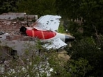Tail of an Air India Boeing 787 Dreamliner plane that crashed is seen stuck on a building after the incident in Ahmedabad.