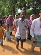 Residents of Sai Nagar in Bathinda wading through water after a breach in the Sirhind Canal distributary flooded the locality on Friday morning. (Sanjeev Kumar/HT)
