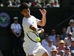 Spain's Carlos Alcaraz plays a forehand return to US player Taylor Fritz during their men's singles semi-final Spain's Carlos Alcaraz plays a forehand return to US player Taylor Fritz during their men's singles semi-final