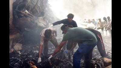 Rescue officials work at the site where Air India flight 171 crashed in a residential area near the airport in Ahmedabad on June 12, 2025. (File/AFP) Rescue officials work at the site where Air India flight 171 crashed in a residential area near the airport in Ahmedabad on June 12, 2025. (File/AFP)