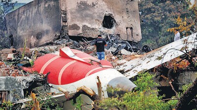 A firefighter stands next to the crashed Air India Boeing 787-8 Dreamliner aircraft, in Ahmedabad, India, on June 13, 2025. (REUTERS) A firefighter stands next to the crashed Air India Boeing 787-8 Dreamliner aircraft, in Ahmedabad, India, on June 13, 2025. (REUTERS)