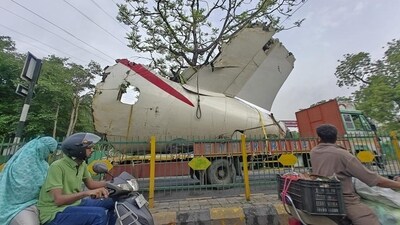 A truck carrying wreckage of the Air India plane that recently crashed into a medical hostel and its canteen complex passes by, in Ahmedabad, on Sunday. (File) A truck carrying wreckage of the Air India plane that recently crashed into a medical hostel and its canteen complex passes by, in Ahmedabad, on Sunday. (File)