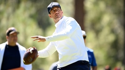 Aaron Rodgers throws a football out of the seventh tee box prior to the American Century Championship at Edgewood Tahoe Golf Course (Getty Images via AFP) Aaron Rodgers throws a football out of the seventh tee box prior to the American Century Championship at Edgewood Tahoe Golf Course (Getty Images via AFP)