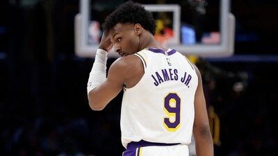 Bronny James #9 of the Los Angeles Lakers walks on the court against the Minnesota Timberwolves (Getty Images via AFP) Bronny James #9 of the Los Angeles Lakers walks on the court against the Minnesota Timberwolves (Getty Images via AFP)