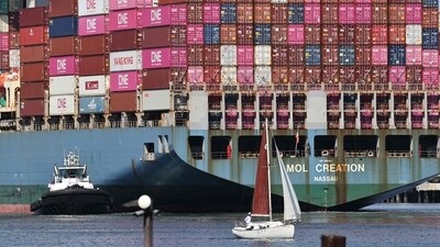 A sailboat passes shipping containers stacked on a container ship at the Port of Los Angeles on June 25, 2025 in Los Angeles, California. (Getty Images via AFP) A sailboat passes shipping containers stacked on a container ship at the Port of Los Angeles on June 25, 2025 in Los Angeles, California. (Getty Images via AFP)