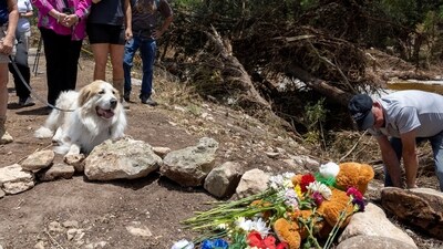 At least 27 people have died in the flash floods at Camp Mystic, Texas. People honour those who lost their lives with flowers and a cross placed near the Guadalupe River. (REUTERS)