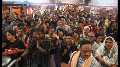 Devotees throng Mankameshwar temple in city on Monday. (HT Photo)