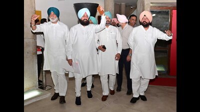 Leader of Opposition Partap Singh Bajwa along with other Congress MLAs walk out of the Punjab vidhan sabha on Friday. (Ravi Kumar/HT) Leader of Opposition Partap Singh Bajwa along with other Congress MLAs walk out of the Punjab vidhan sabha on Friday. (Ravi Kumar/HT)