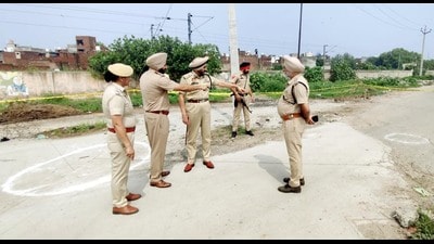 Police at the encounter site near Bhagtanwala grain market, Amritsar, on Friday.