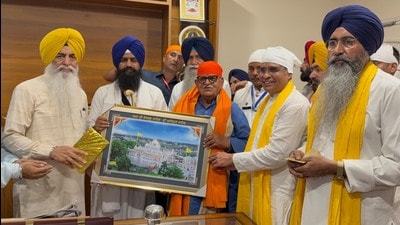 Punjab governor Gulab Chand Kataria being honoured by Akal Takht acting jathedar Giani Kuldeep Singh Gargaj at Anandpur Sahib on Friday. Punjab governor Gulab Chand Kataria being honoured by Akal Takht acting jathedar Giani Kuldeep Singh Gargaj at Anandpur Sahib on Friday.