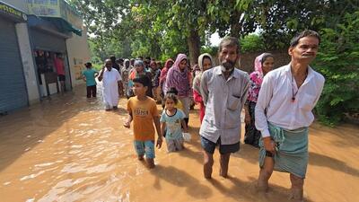 Residents of Sai Nagar in Bathinda wading through water after a breach in the Sirhind Canal distributary flooded the locality on Friday morning. (Sanjeev Kumar/HT) Residents of Sai Nagar in Bathinda wading through water after a breach in the Sirhind Canal distributary flooded the locality on Friday morning. (Sanjeev Kumar/HT)