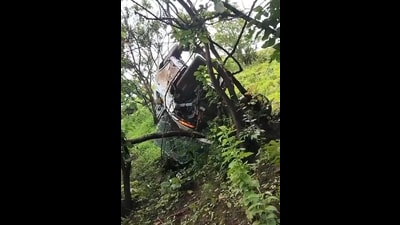 The video captures the harrowing moment the car, driven on a steep, grass-covered slope, loses control and slips into the deep ditch (Video grab) The video captures the harrowing moment the car, driven on a steep, grass-covered slope, loses control and slips into the deep ditch (Video grab)