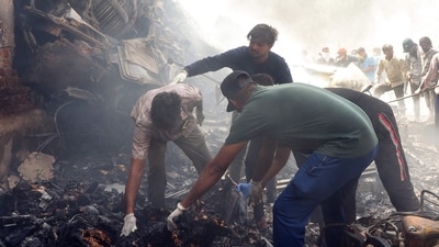Rescue officials work at the site where Air India flight 171 crashed in a residential area near the airport in Ahmedabad (AFP) Rescue officials work at the site where Air India flight 171 crashed in a residential area near the airport in Ahmedabad (AFP)