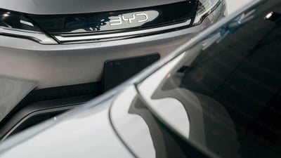 A BYD Yuan Pro electric vehicle in a showroom. A BYD Yuan Pro electric vehicle in a showroom.