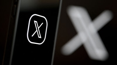 This illustration photograph shows the logo of social network X (formerly Twitter) displayed on a smartphone. (AFP/File)