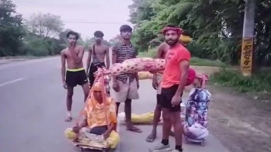 The brothers and their elderly grandmother while passing through the Bhadal village on the Baraut-Budhana Kanwar route in Meerut division (Sourced)