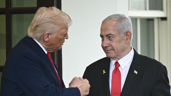 US President Donald Trump shakes hands with Israeli Prime Minister Benjamin Netanyahu as Netanyahu departs the White House in Washington, DC. (AFP)