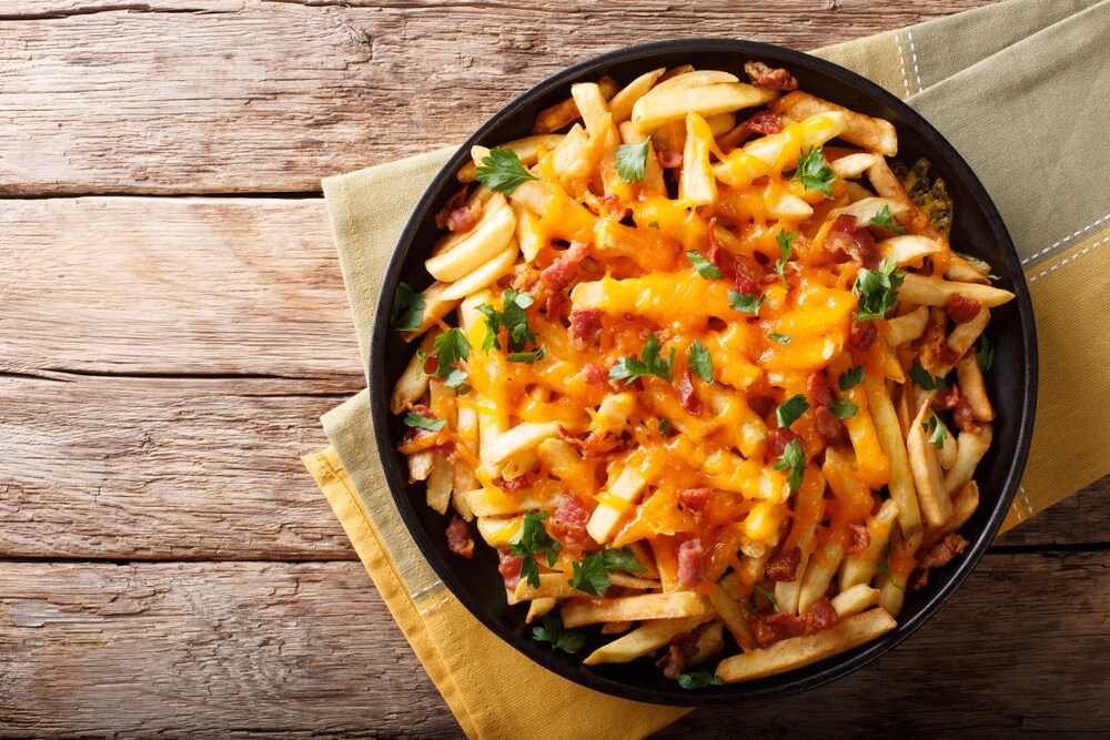 Cheesy fries with chicken is a match made in heaven. (Shutterstock) Cheesy fries with chicken is a match made in heaven. (Shutterstock)