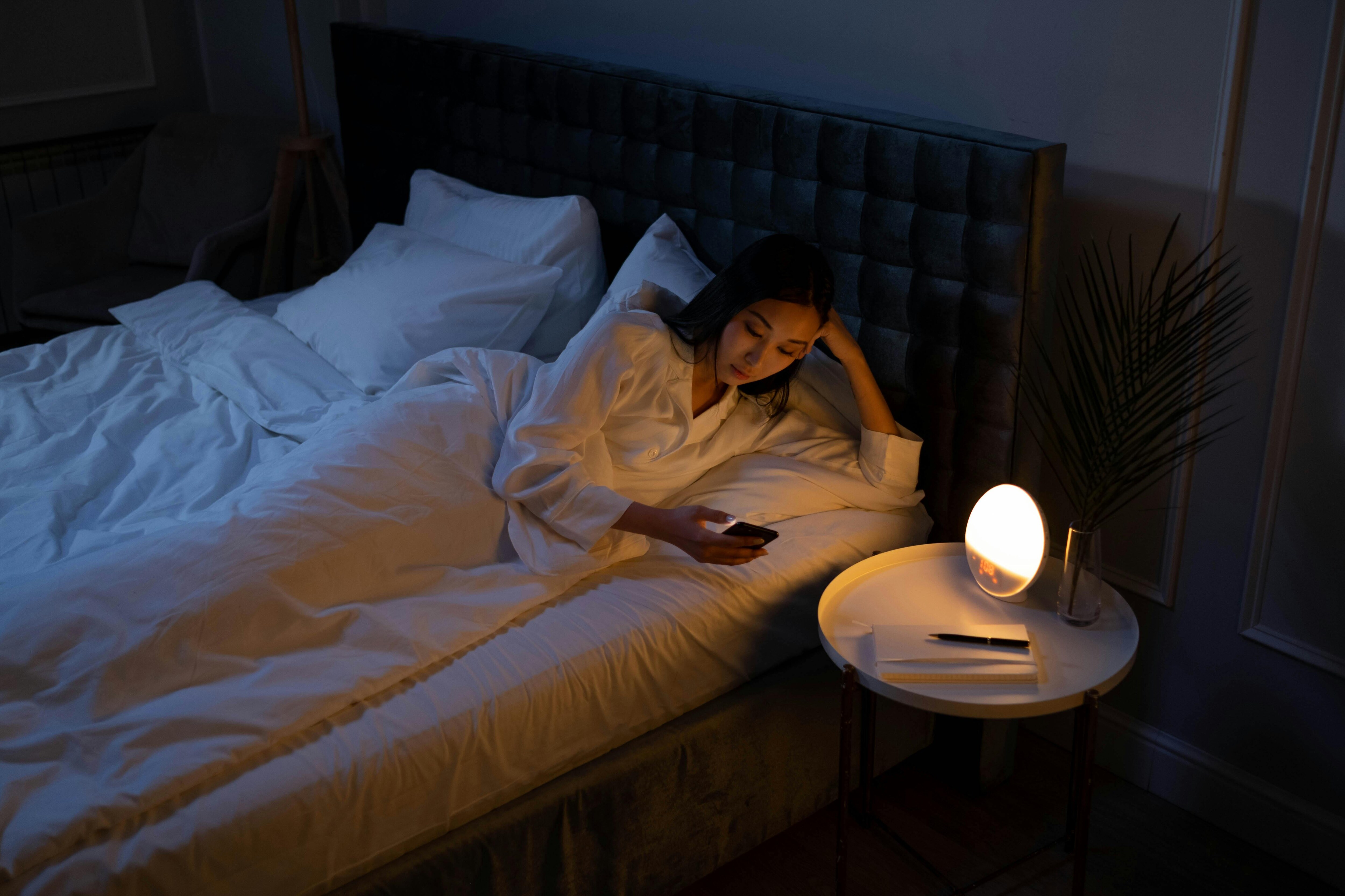 Sleep helps to make you less anxious, so avoid scrolling on your phone 1-2 hours before bedtime. (Pexels.)