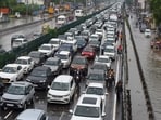 Traffic congestion on National Highway-48 due to waterlogging on the service road after heavy rain near the foot overbridge in Narsinghpur village, in Gurugram. Traffic congestion on National Highway-48 due to waterlogging on the service road after heavy rain near the foot overbridge in Narsinghpur village, in Gurugram.