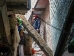 A fireman stands amid debris during a rescue operation after a four-story building collapsed in the Welcome area of New Delhi on Saturday, July 12, 2025. A fireman stands amid debris during a rescue operation after a four-story building collapsed in the Welcome area of New Delhi on Saturday, July 12, 2025.