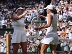 Iga Świątek achieves an unprecedented double bagel at Wimbledon, defeating Amanda Anisimova in the final. REUTERS/Toby Melville