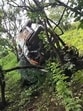 The video captures the harrowing moment the car, driven on a steep, grass-covered slope, loses control and slips into the deep ditch (Video grab) The video captures the harrowing moment the car, driven on a steep, grass-covered slope, loses control and slips into the deep ditch (Video grab)
