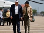 President Donald Trump and first lady Melania Trump visit walk across the tarmac at Lackland Air Force Base after meeting with state and local leaders, first responders and victims of last week's flash flooding on July 11, 2025 in San Antonio, Texas. 
