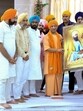 Uttar Pradesh chief minister Yogi Adityanath with others during the flagging-off of UP-Delhi ‘Balidan Sandesh Yatra’, being held to mark the 350th martyrdom day of Guru Teg Bahadur, in Lucknow. (PTI) Uttar Pradesh chief minister Yogi Adityanath with others during the flagging-off of UP-Delhi ‘Balidan Sandesh Yatra’, being held to mark the 350th martyrdom day of Guru Teg Bahadur, in Lucknow. (PTI)