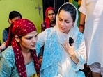 BJP MP Kangana Ranaut interacts with locals as she visits a flood-affected area, in Mandi district, Monday, July 7. BJP MP Kangana Ranaut interacts with locals as she visits a flood-affected area, in Mandi district, Monday, July 7.