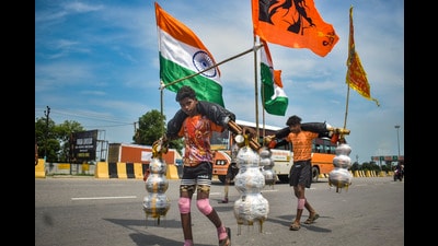 ‘Kanwariyas’ carry holy water during the ‘Kanwar Yatra’ in Meerut on Saturday. (PTI) ‘Kanwariyas’ carry holy water during the ‘Kanwar Yatra’ in Meerut on Saturday. (PTI)