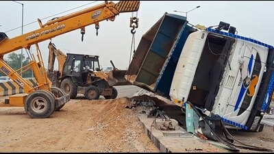 A crane lifts the overturned truck on the elevated flyover connecting the bus stand to Ferozepur Road in Ludhiana on Saturday. (HT Photo) A crane lifts the overturned truck on the elevated flyover connecting the bus stand to Ferozepur Road in Ludhiana on Saturday. (HT Photo)