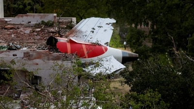 Tail of Air India Boeing 787 Dreamliner plane that crashed is seen stuck on a building after the incident in Ahmedabad. (REUTERS)