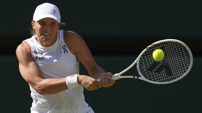 Iga Swiatek returns to Amanda Anisimova during the women's singles final. (AP) Iga Swiatek returns to Amanda Anisimova during the women's singles final. (AP)