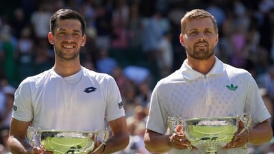 Julian Cash and Lloyd Glasspool of Britain won the Wimbledon 2025 men's doubles final match against Rinky Hijikata of Australia and David Pel of the Netherlands. (AP) Julian Cash and Lloyd Glasspool of Britain won the Wimbledon 2025 men's doubles final match against Rinky Hijikata of Australia and David Pel of the Netherlands. (AP)