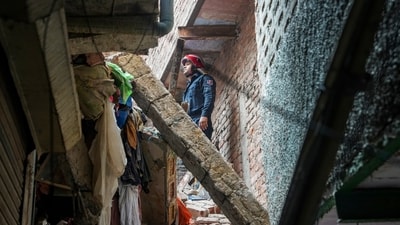 A fireman stands amid debris during a rescue operation after a four-story building collapsed in the Welcome area of New Delhi on Saturday, July 12, 2025. (PTI) A fireman stands amid debris during a rescue operation after a four-story building collapsed in the Welcome area of New Delhi on Saturday, July 12, 2025. (PTI)