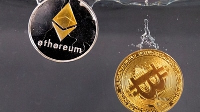 Souvenir tokens representing cryptocurrency Bitcoin and the Ethereum network, with its native token ether. (REUTERS/ Representational)