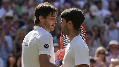 Spain's Carlos Alcaraz, right, greets Taylor Fritz of the US after beating him in their Wimbledon semi-final. (AP) Spain's Carlos Alcaraz, right, greets Taylor Fritz of the US after beating him in their Wimbledon semi-final. (AP)