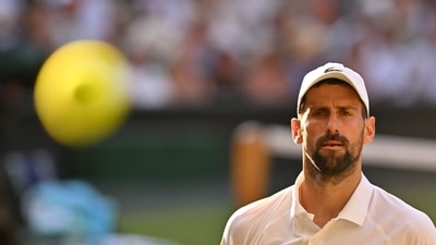 Serbia's Novak Djokovic reacts as he plays against Italy's Jannik Sinner. (AFP) Serbia's Novak Djokovic reacts as he plays against Italy's Jannik Sinner. (AFP)