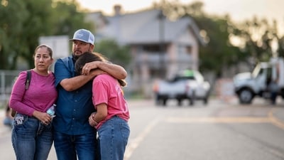 A family grieves together during a candlelight vigil to honor the lives lost in the flash floods that claimed more than 120 lives on July 11, 2025 in Kerrville, Texas. (Getty Images via AFP) A family grieves together during a candlelight vigil to honor the lives lost in the flash floods that claimed more than 120 lives on July 11, 2025 in Kerrville, Texas. (Getty Images via AFP)