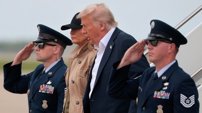 President Donald Trump and first lady Melania Trump arrive at Lackland Air Force Base to survey damage and meet with first responders and victims of last week's flash flooding on July 11, 2025 in San Antonio, Texas. (Getty Images via AFP) President Donald Trump and first lady Melania Trump arrive at Lackland Air Force Base to survey damage and meet with first responders and victims of last week's flash flooding on July 11, 2025 in San Antonio, Texas. (Getty Images via AFP)