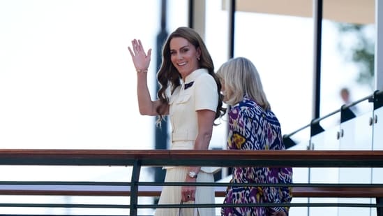 Britain's Kate, Princess of Wales waves as she arrives with Deborah Jevans of the All England Club to attend the women's singles final between Poland's Iga Swiatek and Amanda Anisimova of the US at the Wimbledon Tennis Championships in London, Saturday, July 12, 2025. (Andrew Matthews/PA via AP)(AP)