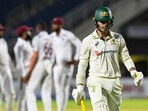 Alex Carey of Australia walks off the field dismissed by Justin Greaves of West Indies.