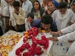 Relatives mourning by the coffins of victims, who were killed in the Air India flight AI171 crash. Relatives mourning by the coffins of victims, who were killed in the Air India flight AI171 crash.